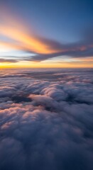 Fototapeta premium Aerial view above clouds during a colorful sunset