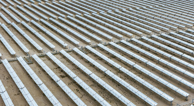 Aerial Close-Up of Parabolic Trough Solar Collectors in Desert