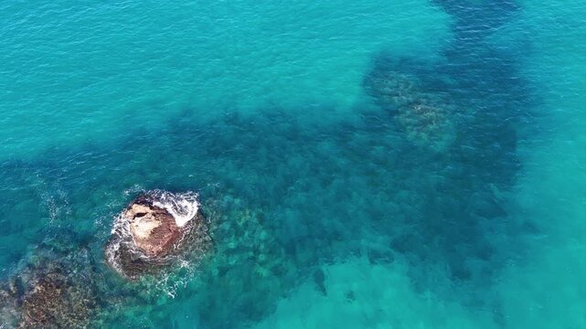 Aerial View of Turquoise Ocean Water and Coral Reef