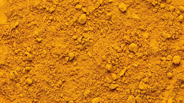 Golden turmeric powder texture