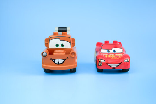 Lightning McQueen and Tow Mater toy figures stand side by side on a light blue background with both character faces visible on Jul 29, 2026 in Jakarta, Indonesia