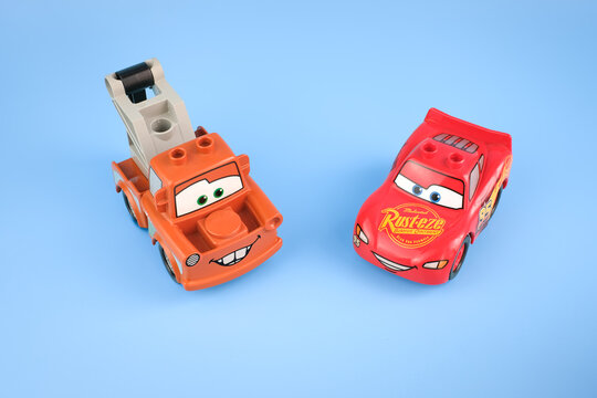 Tow Mater and Lightning McQueen toy cars are photographed from a high angle on a light blue background showing both character designs on Jul 29, 2026 in Jakarta, Indonesia.