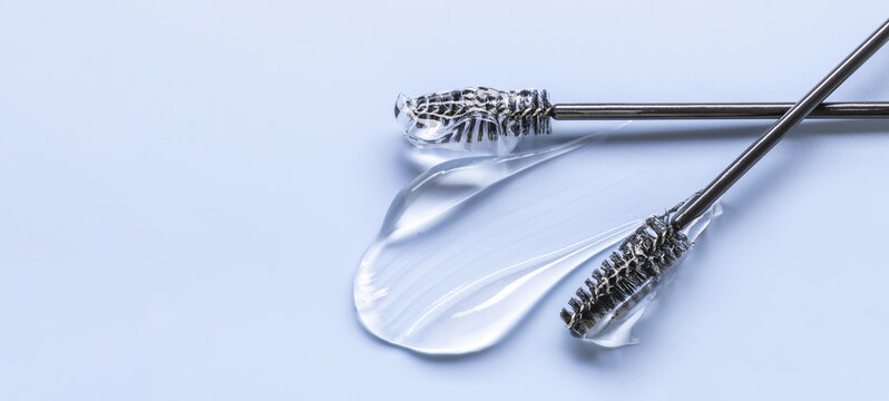 transparent eyelash eyebrow gel serum, smooth and shiny texture stroke, pastel background