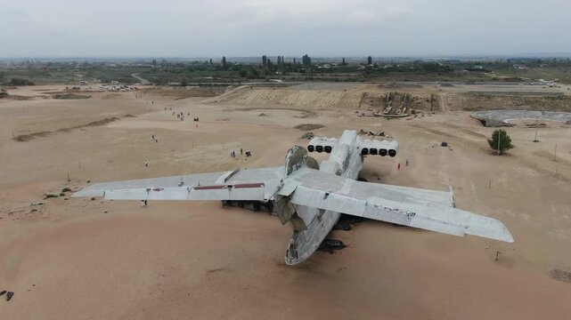 Aerial drone view of the giant Soviet Lun-class ekranoplan beached on the sandy coast near Derbent, Dagestan, Russia