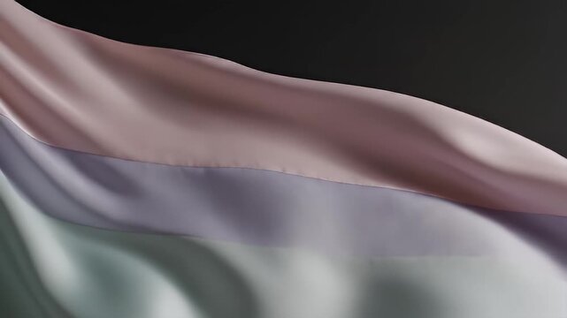 A soft draped fabric with three distinct horizontal color bands against a dark background