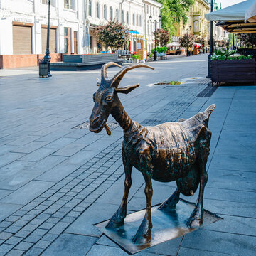 The bronze sculpture "Merry Goat" on the pedestrian street Bolshaya Pokrovskaya in Nizhny Novgorod