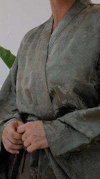 Close up of elegant woman wearing luxury kimono robe.