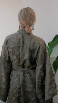 Close up of elegant woman wearing luxury kimono robe.