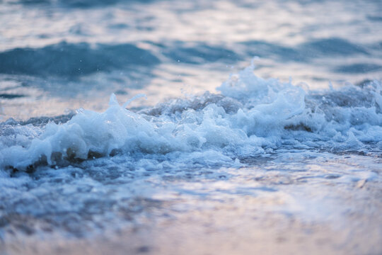 Landscape image of sea wave splashing on beach