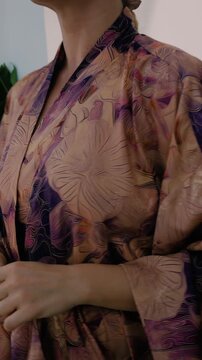 Close up of elegant woman wearing luxury kimono robe.