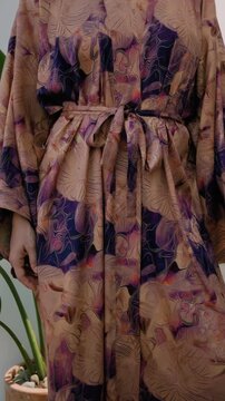 Close up of elegant woman wearing luxury kimono robe.