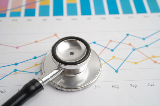 Stethoscope on chart or graph paper, Financial, account, statistics and business data medical health.