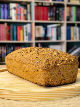Fresh Keto Seed Bread Loaf Displayed on Wooden Board