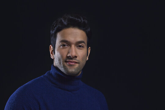 Portrait of a smiling man wearing blue colour polo neck t-shirt 