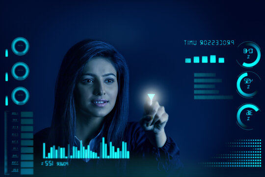 Businesswoman pointing down arrow,graphs and charts seen through screen