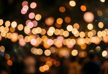 Fototapeta premium Abstract warm bokeh background with sparkling party string lights