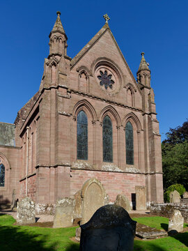The East side of Brechin Cathedral chancel and choir with its upper carved round window and south Transept on a clear summers day.