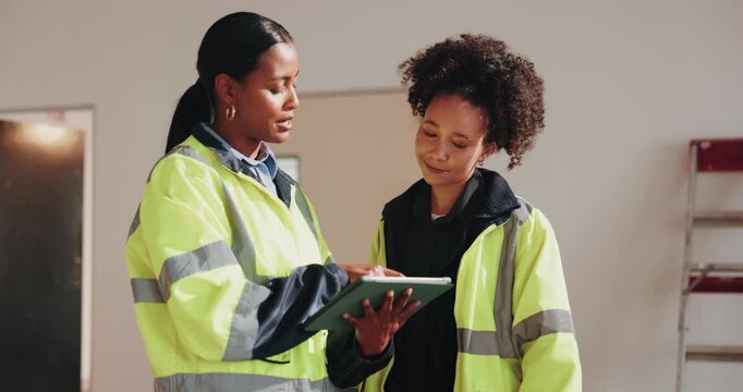 Construction, women and meeting on site with tablet, check project timeline and team conversation. People, talk and review schedule with tech for commercial building renovation, planning and update.
