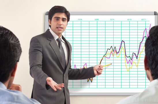 Businessman presenting to colleagues�