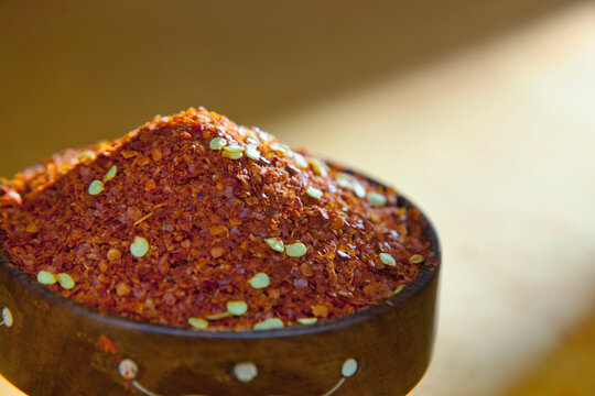 Chilli powder in wooden bowl
