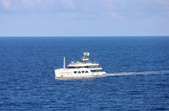 A Luxury Superyacht Cruising on Open Ocean.