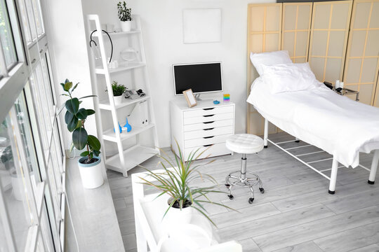 Interior of hospital ward with bed and monitor