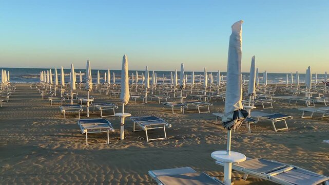End of season. In the evening among empty deckchairs and parasols