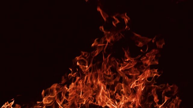 Real flames against a black background with natural fire. Fire overlay, for visual effects, compositing, motion graphics, cinematic backgrounds, and burning concepts.