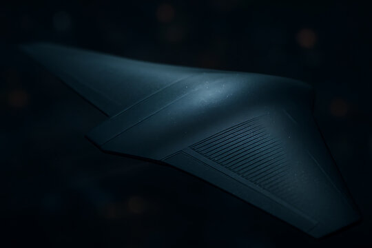 Closeup of futuristic black metallic aircraft wing surface in dramatic low light