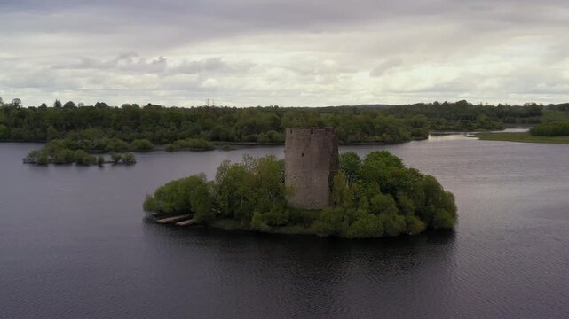 Static aerial shot of Cloughoughter Castle on calm evening in slow motion, County Cavan Ireland