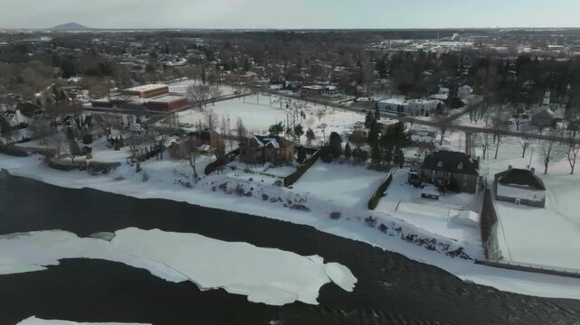 drone very completed take showing the old houses of old towm n from the river richeliea u n church all the way to the damn inside the river