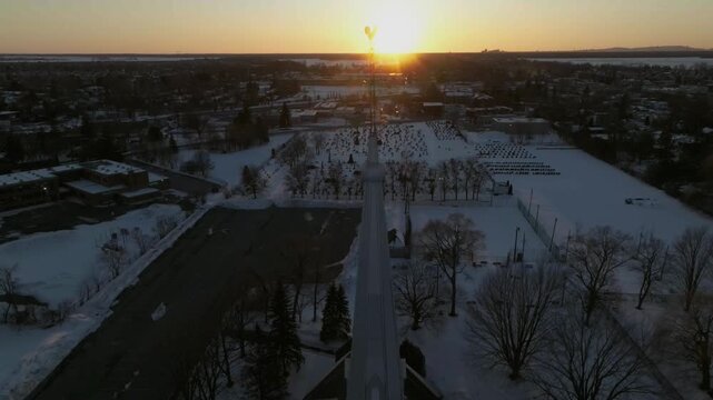 drone desending from top main croosi n the bigest church in chambly quebec canada to the main doors n floor of the church in winter
