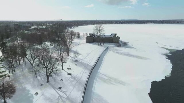 drone approaching from the back to castle fort chambly in quebec canada n going around next to river richelieau