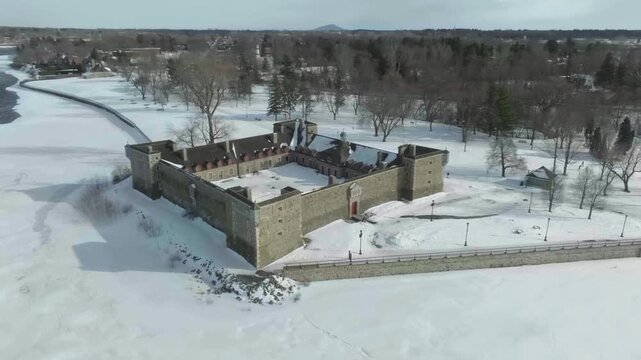 drone approching the fort castle chambly from the main entry all the way to be on top of the castle front