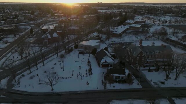 drone side move overlooking the historic part of chambly quebec canada incluiding the light house city hall n monuments in the coastline