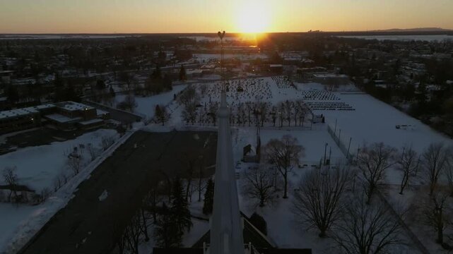 drone desending showing the front of the bigest church in chambly canada from main to cross to the botton n statue n floor n door in the bottom