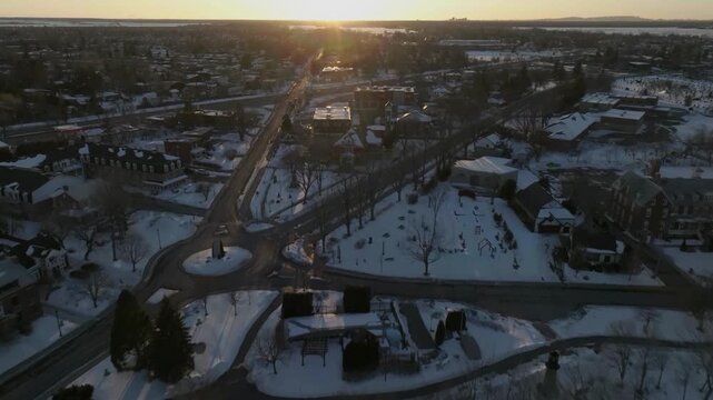 drone approaching to the main street of the city of chambly quebec canada in winter exposing the monuments n the city hall main library