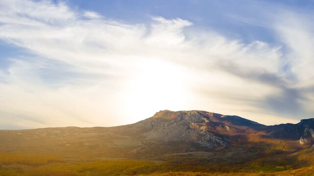 autumn mountain valley with red forest at the sunset time lapse scene