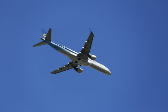 A Mandarin Airlines Embraer E190 Flies Overhead.
