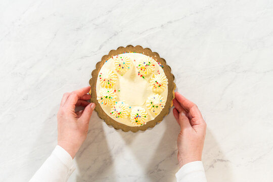 Hands Holding Small Round Birthday Cake