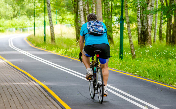Cyclist ride on the bike path in the city Park
