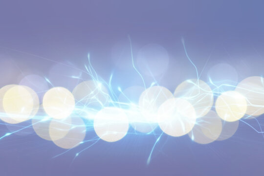 Abstract background of light blue shades with glare and bokeh effect.