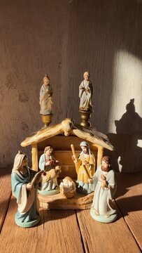 Nativity Scene Figurines In Warm Sunlit Interior