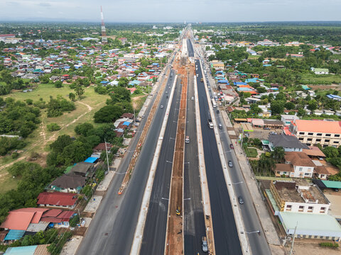 Aerial Photo of Urban Highway Expansion Construction with Fresh Asphalt and Traffic
