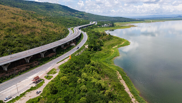 Drone shot The M6 motorway Nakhon Ratchasima Province - Bang Pa-in Lam Ta Khong River and Mountain. Motorway Korat Thailand