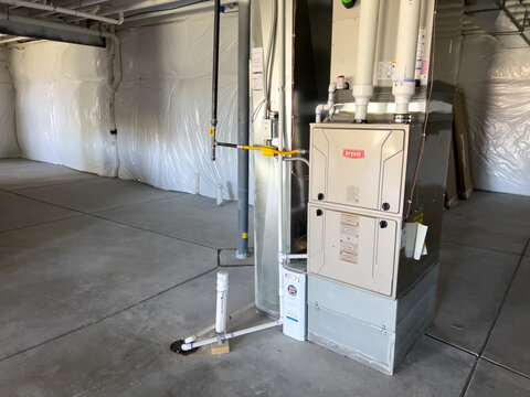 Side View of Furnace in Unfinished Basement