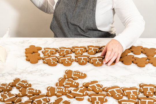 Decorating Gingerbread Man Cookies with Royal Icing for Festive Occasions