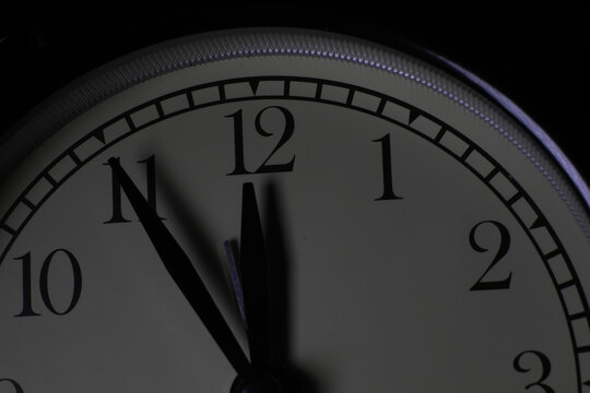 Clock with Time Hands Approaching Midnight Showing Countdown and Late Night Concept