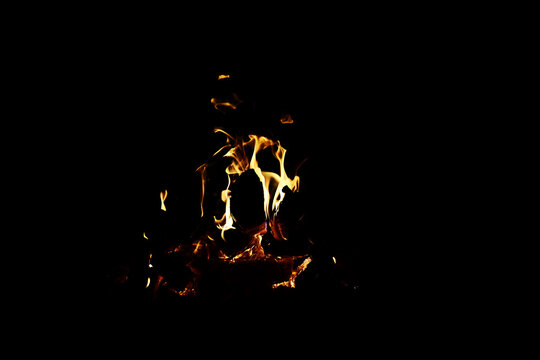Background of the flame in the oven. Overlay layer. Tongues of fire in a brick fireplace.