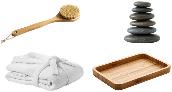 A collection of spa and bath relaxation essentials including a bathrobe, massage stones, bamboo tray, and bath brush.